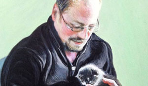 watercolor and acrylic portrait of man holding 3 kittens against a green background