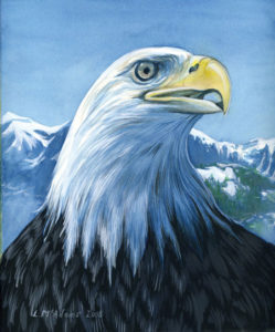 American bald eagle aginst mountain range