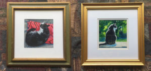2 framed drawings of cats