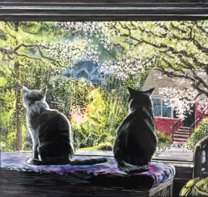 two cats looking out a window at spring blooms.