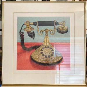 Golden ornate Princess Telephone with black speaker and dials.