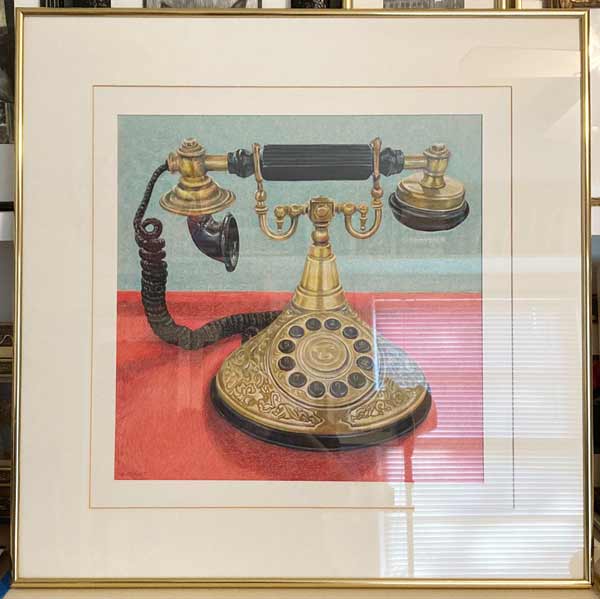 Golden ornate Princess Telephone with black speaker and dials.